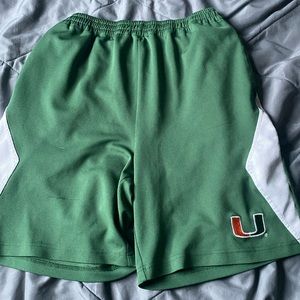 UM shorts green and white strip on the side
